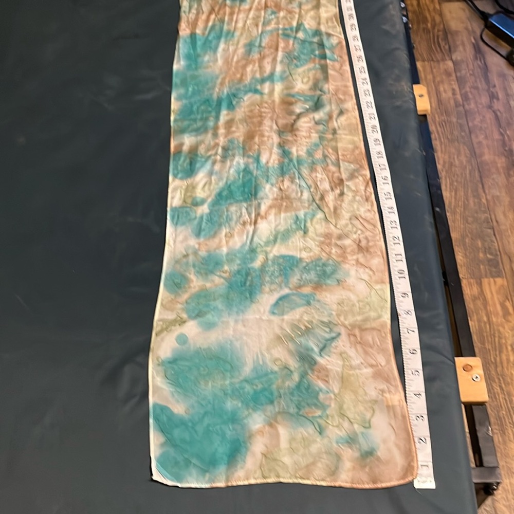 Silk scarf, tan, teal, and white. 58 x 10 1/2 inches.